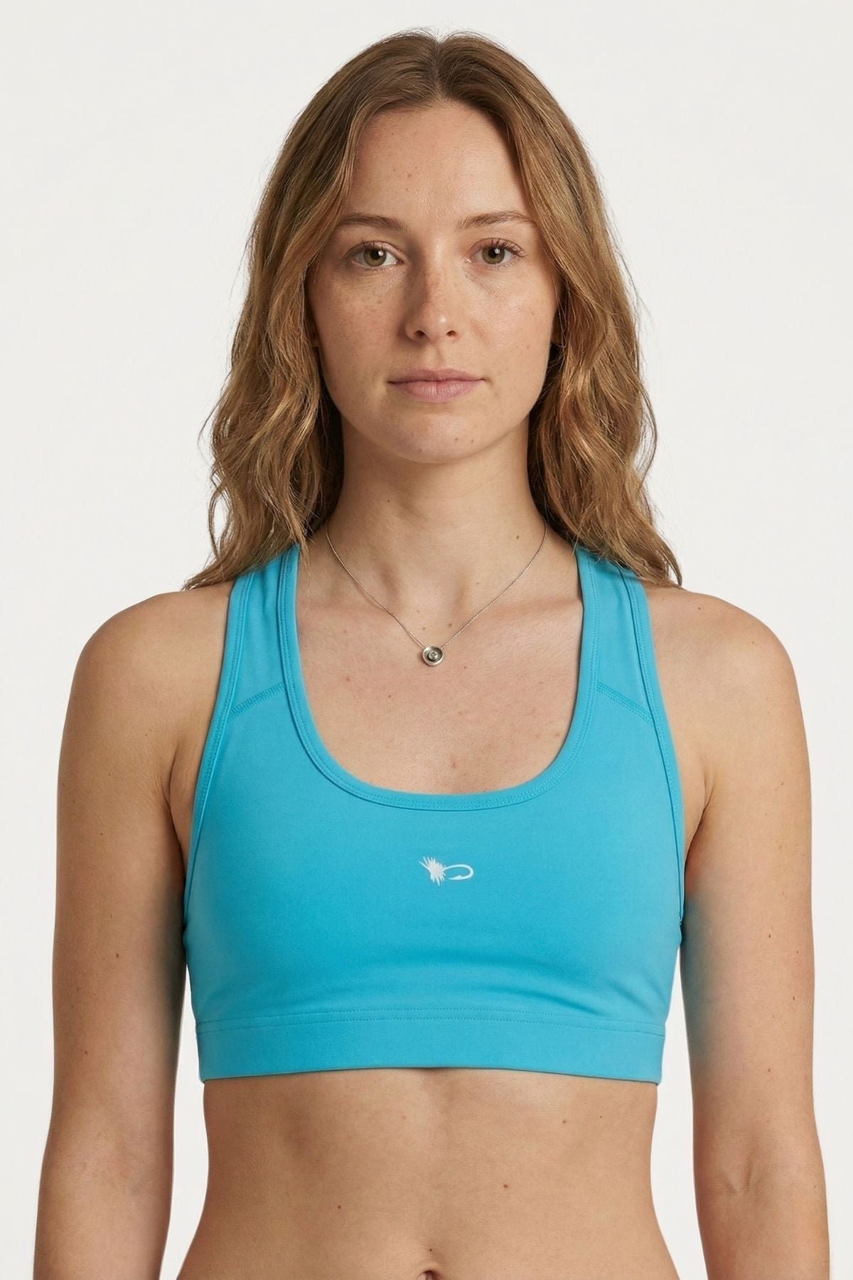 FisheWear Permit Paradise sports bra featuring a vibrant print, supportive design, and breathable fabric for active wear.