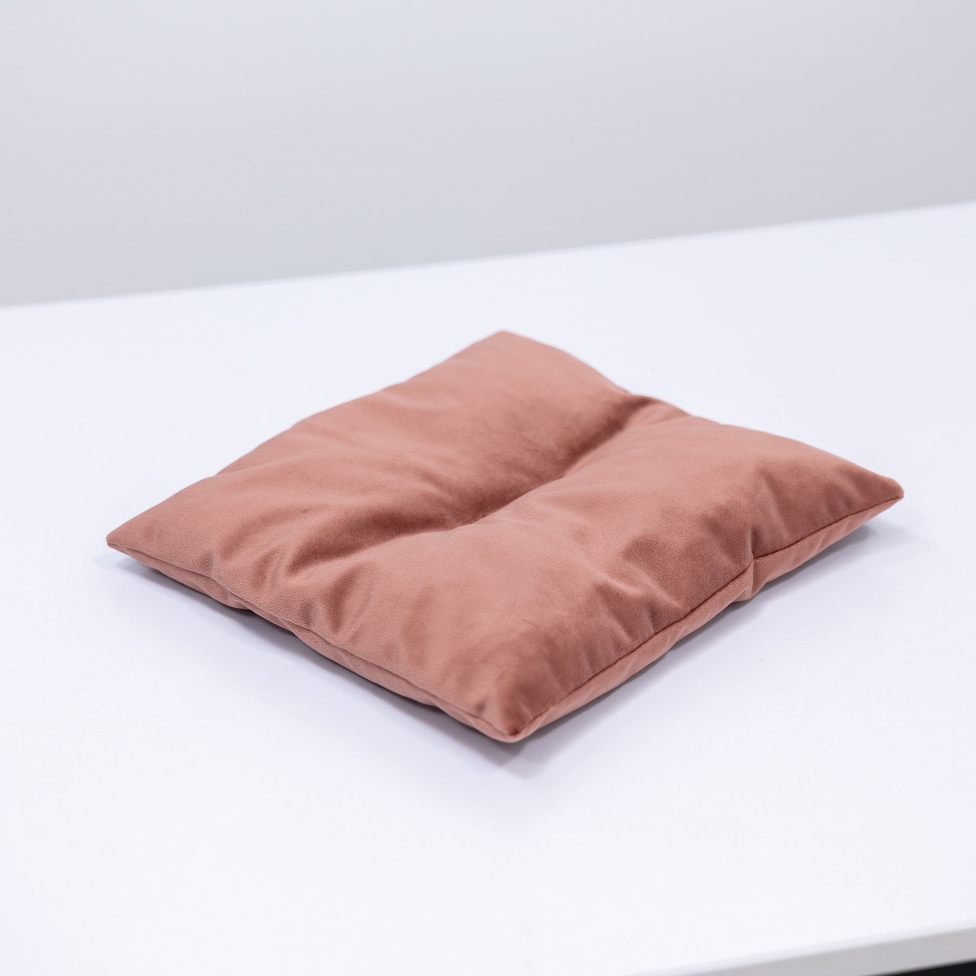Pink cat cushion pillow from Enjoy The Wood, soft and plush decorative cat-shaped cushion for cozy home decor.