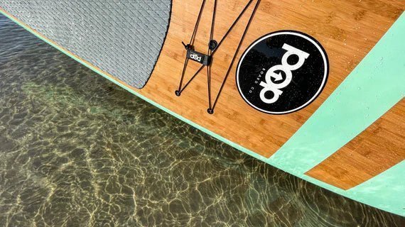 Close-up of the 11'0 Huckleberry popboard by Backcountry Sportsman showing the textured surface and vibrant design.