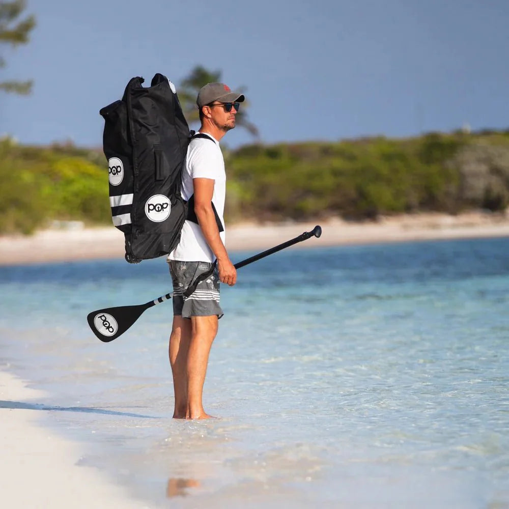 Backcountry Sportsman 11'0 Yacht Hopper inflatable stand-up paddleboard in mint, teak, and blue with carrying bag.