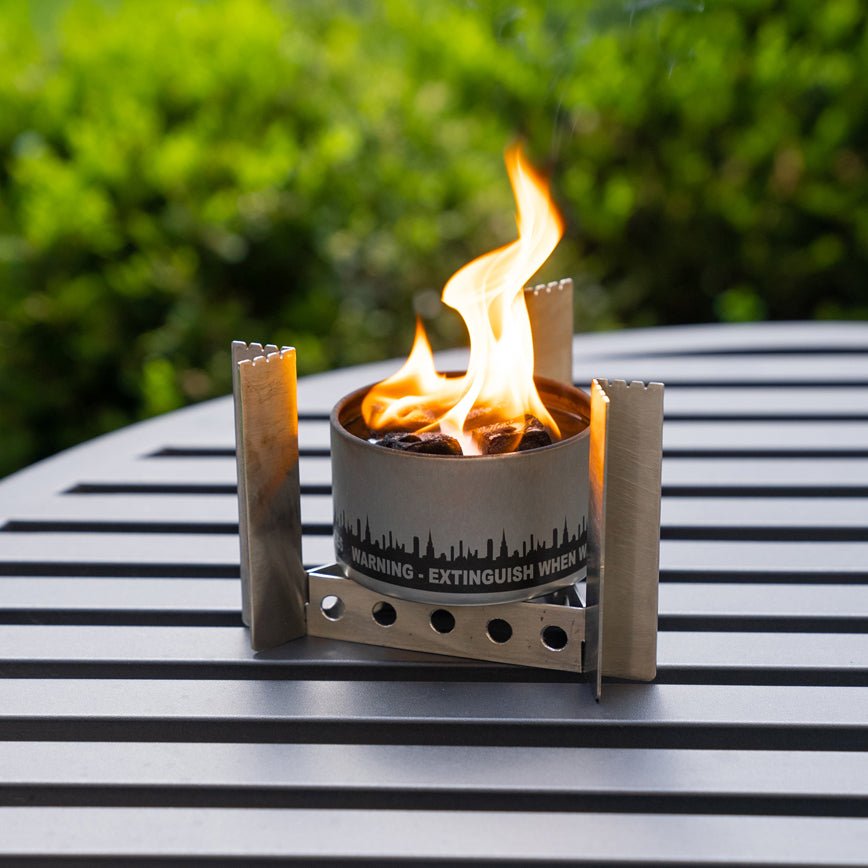 City Bonfires portable camp stove with stand, designed for outdoor cooking and camping convenience.