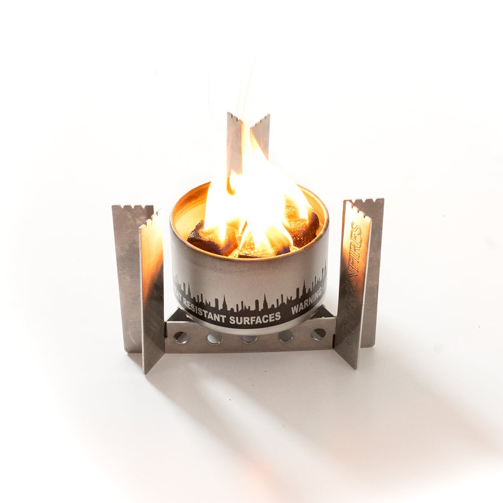 Portable camp stove by City Bonfires with sturdy stand, ideal for outdoor cooking and camping adventures.