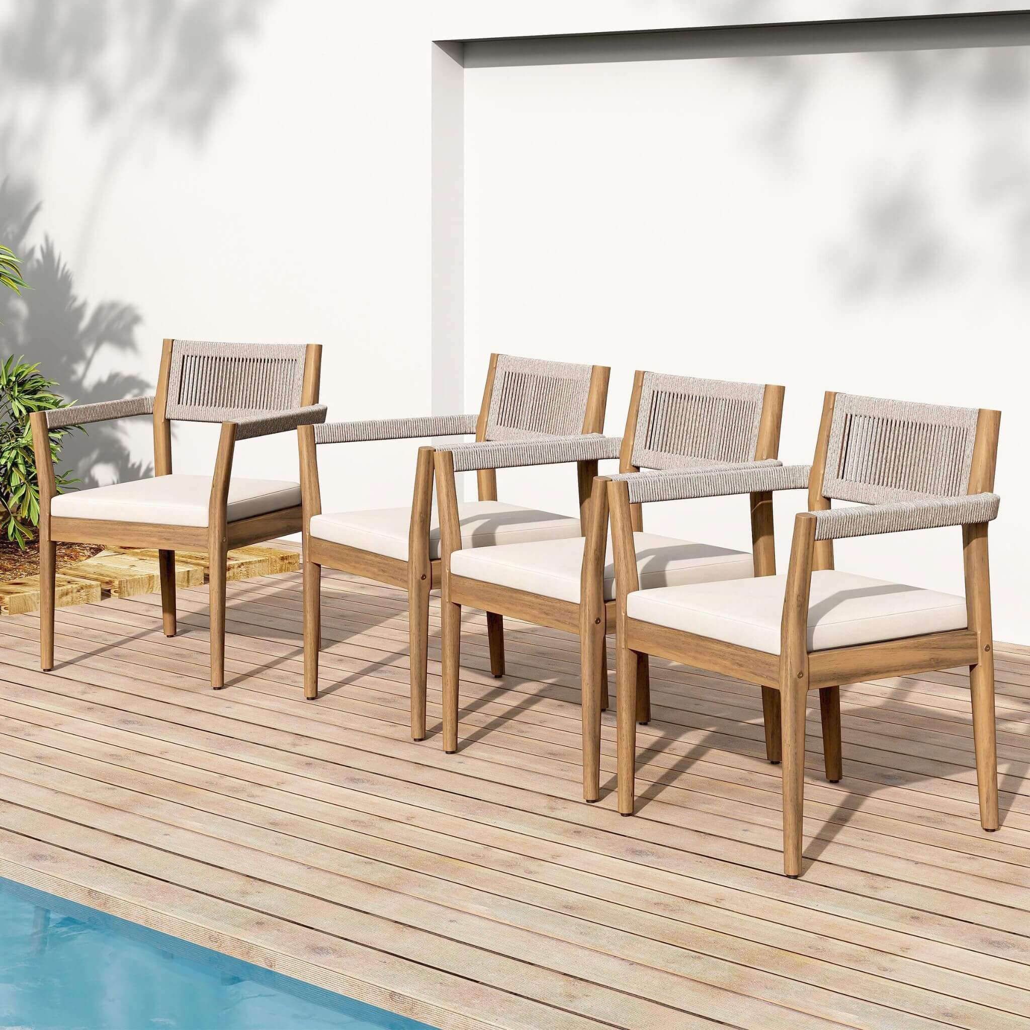 5-piece outdoor acacia wood patio furniture set featuring braided dining chairs and cushions by SAKSBY WHOLESALE.