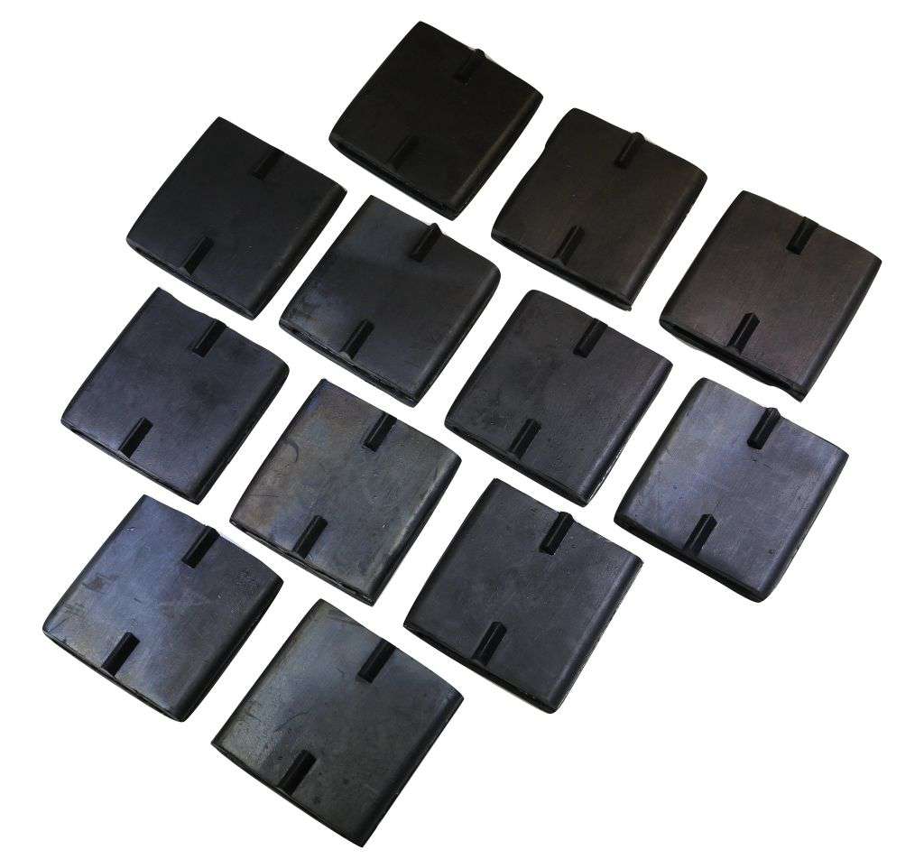 Set of 12 rubber tire cleats for car auto hauler ratchet straps, used for securing vehicles during towing.