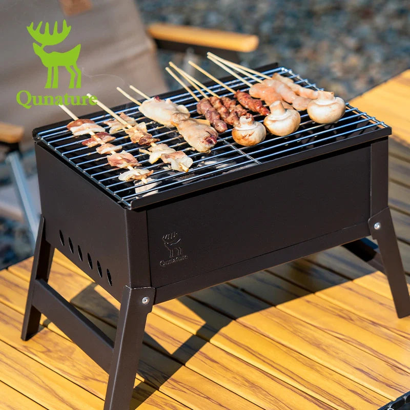 Foldable BBQ grill stove by Qunature Global with chrome-plated net and ventilation for outdoor grilling.