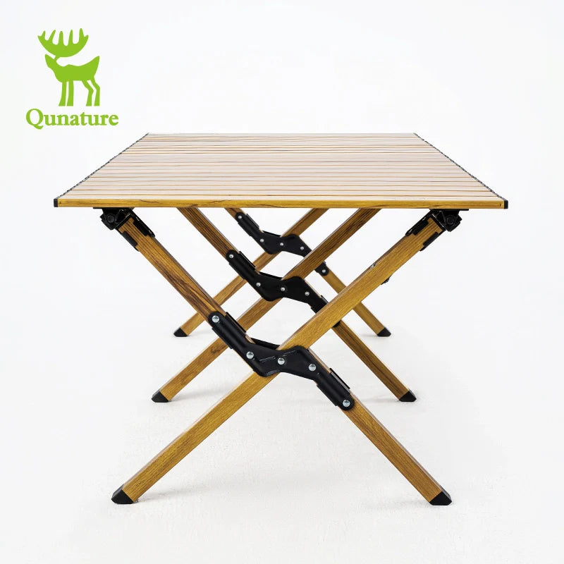 Qunature Global lightweight foldable aluminum table set up for outdoor use, showing its compact, portable design and sturdy construction.
