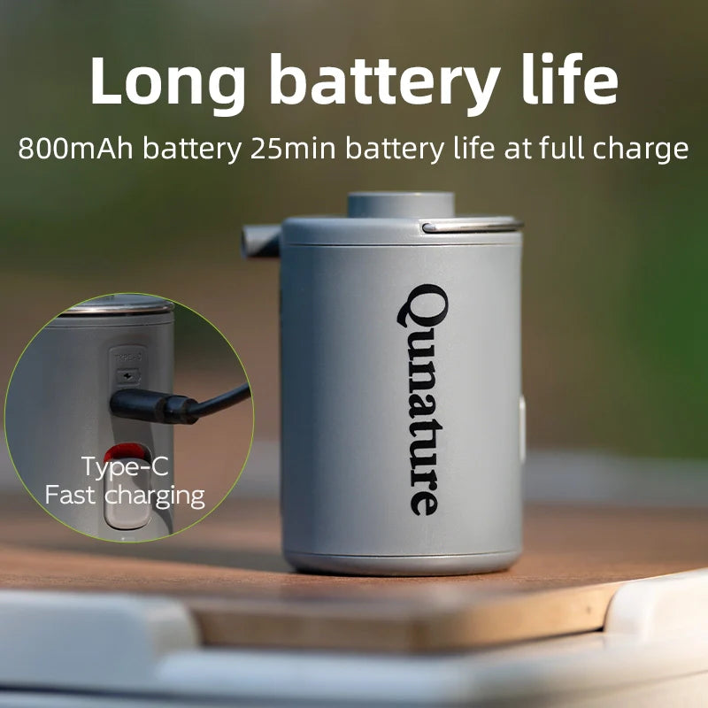 Qunature Global mini electric rechargeable air pump for inflatables, compact design with nozzle attachments visible.
