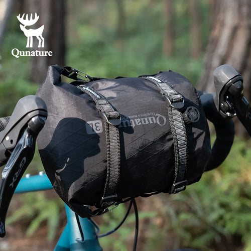 Two adjustable Qunature Global cargo binding straps for bikepacking, designed for secure multi-purpose bike cargo tying.