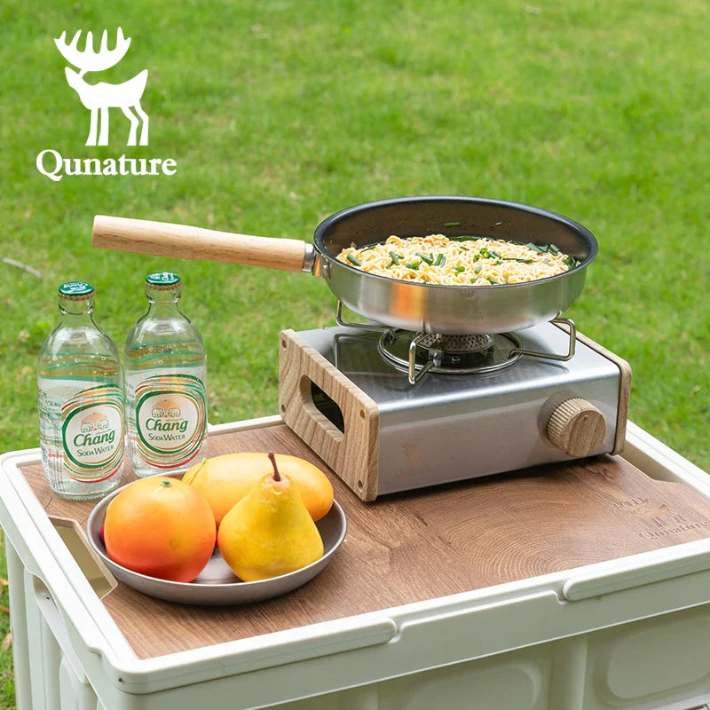 Qunature Global non-stick stainless steel frying pan with detachable handle, showing the pan's smooth cooking surface and ergonomic design.