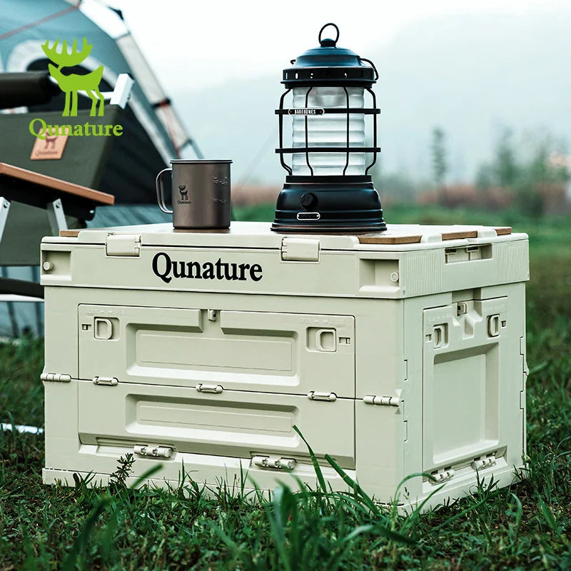 60L and 26L multi-door folding storage boxes with a tabletop by Qunature Global in an outdoor setting.