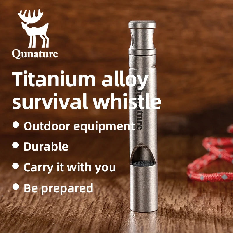 Qunature Global titanium survival whistle with 120dB loud sound, durable, portable outdoor gear, silver-colored metal whistle on a white background.