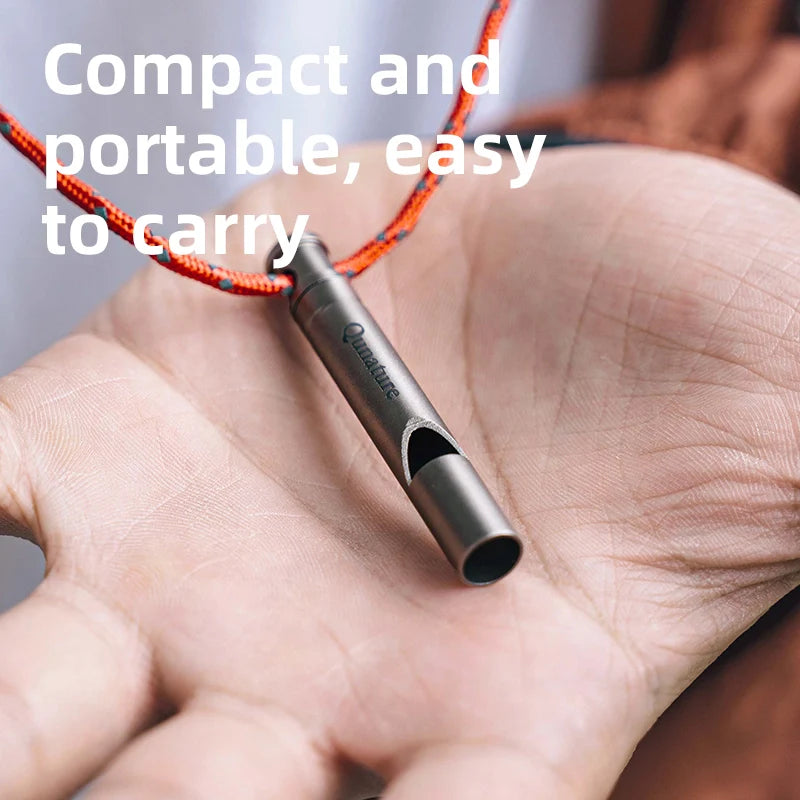 Qunature Global titanium survival whistle emitting a loud 120dB sound, durable and portable outdoor gear for emergency signaling.