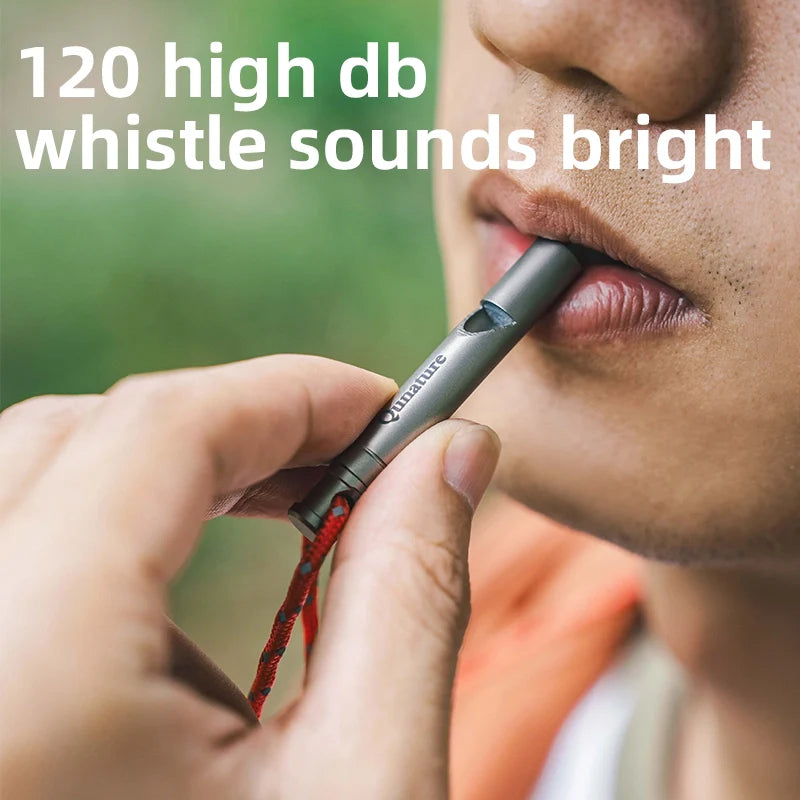 Qunature Global titanium survival whistle with 120dB loud sound, durable and portable outdoor gear for emergency signaling.