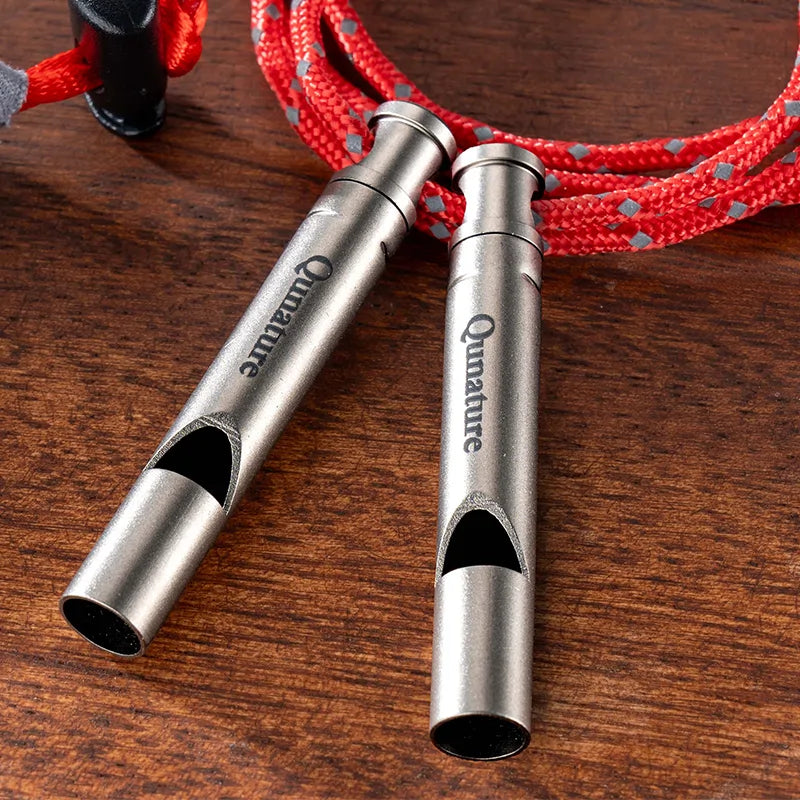 Qunature Global titanium survival whistle with 120dB loud sound, durable, lightweight outdoor gear for emergency and outdoor activities.
