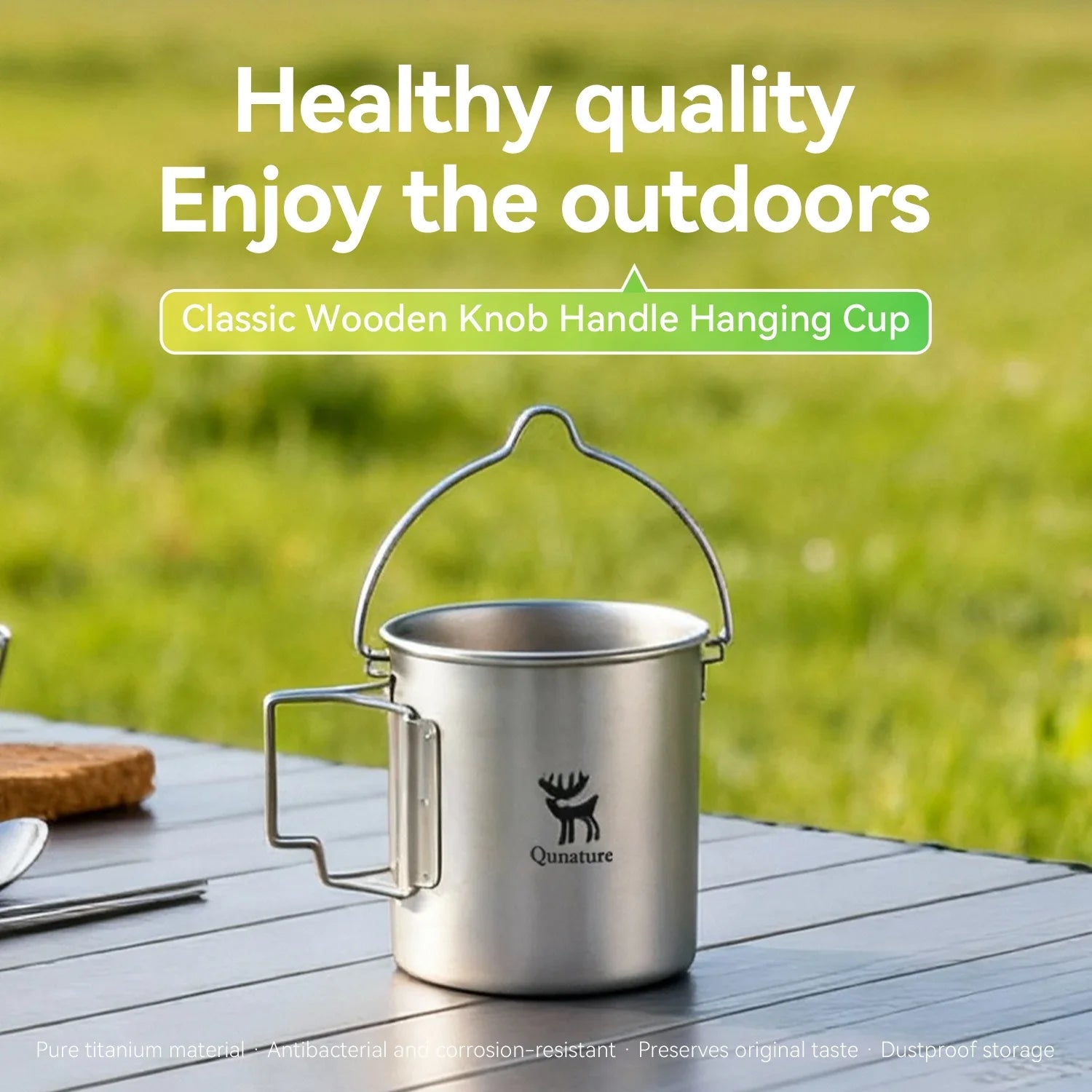 Qunature Global ultralight titanium camping mug 750 ml with a sleek design and ergonomic handle on a camping backdrop.