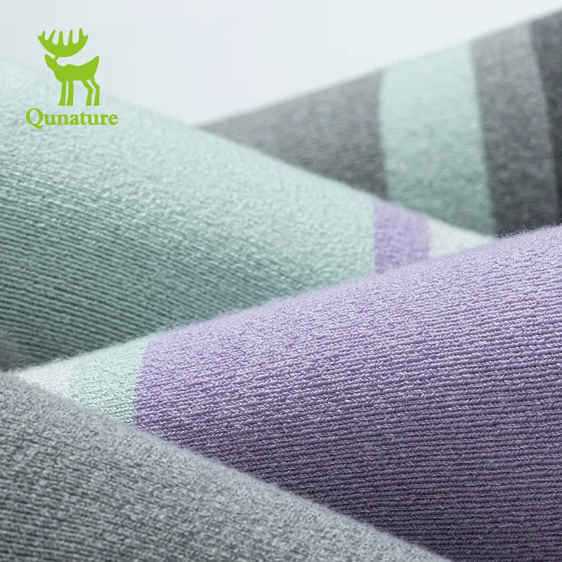 Qunature Global wool ski socks designed for winter warmth, shock absorption, and comfortable skiing performance.