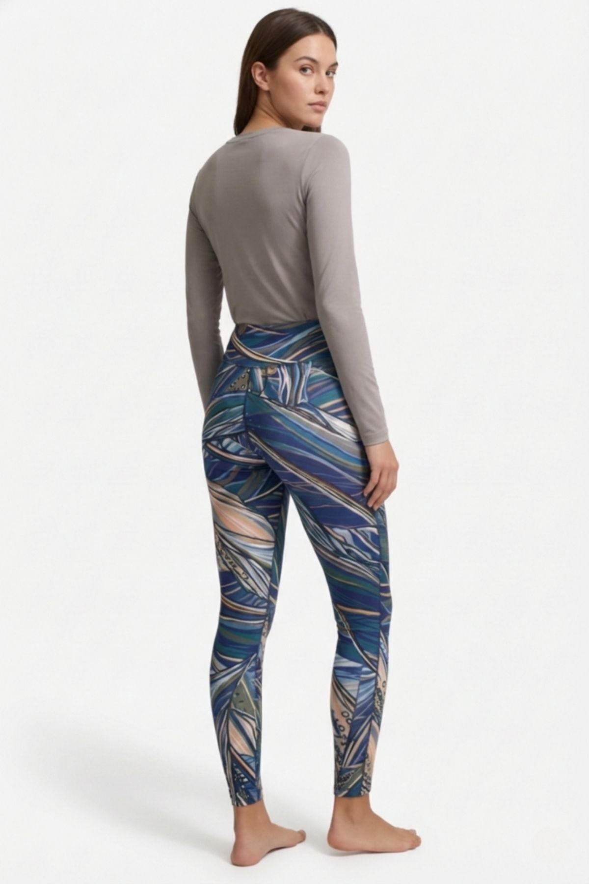 FisheWear Rainbow Ridge high-waisted leggings with colorful rainbow pattern, stretchy fabric, and comfortable fit.