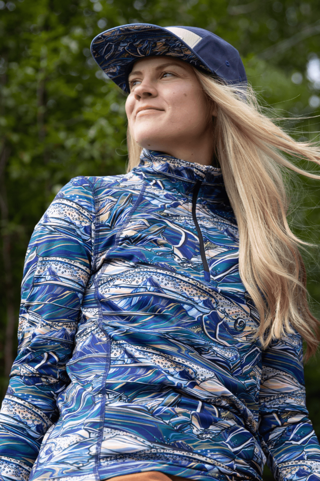 FisheWear Rainbow Ridge Thermal 1/4 Zip Top in vibrant rainbow colors, made of cozy thermal fabric, front zipper detail.
