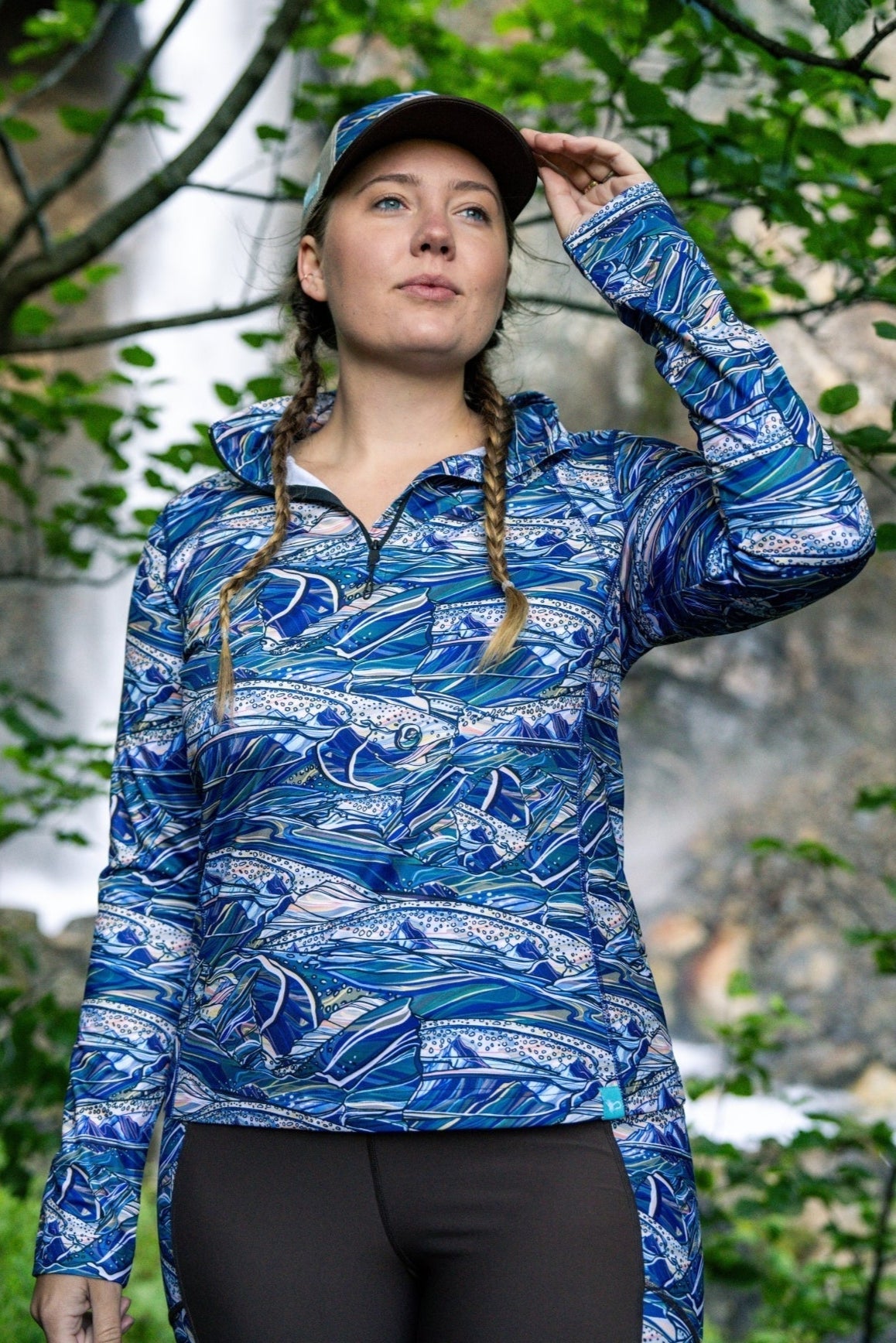 FisheWear Rainbow Ridge Thermal 1/4 Zip Top in vibrant rainbow colors, made of cozy thermal fabric with a quarter-zip front.