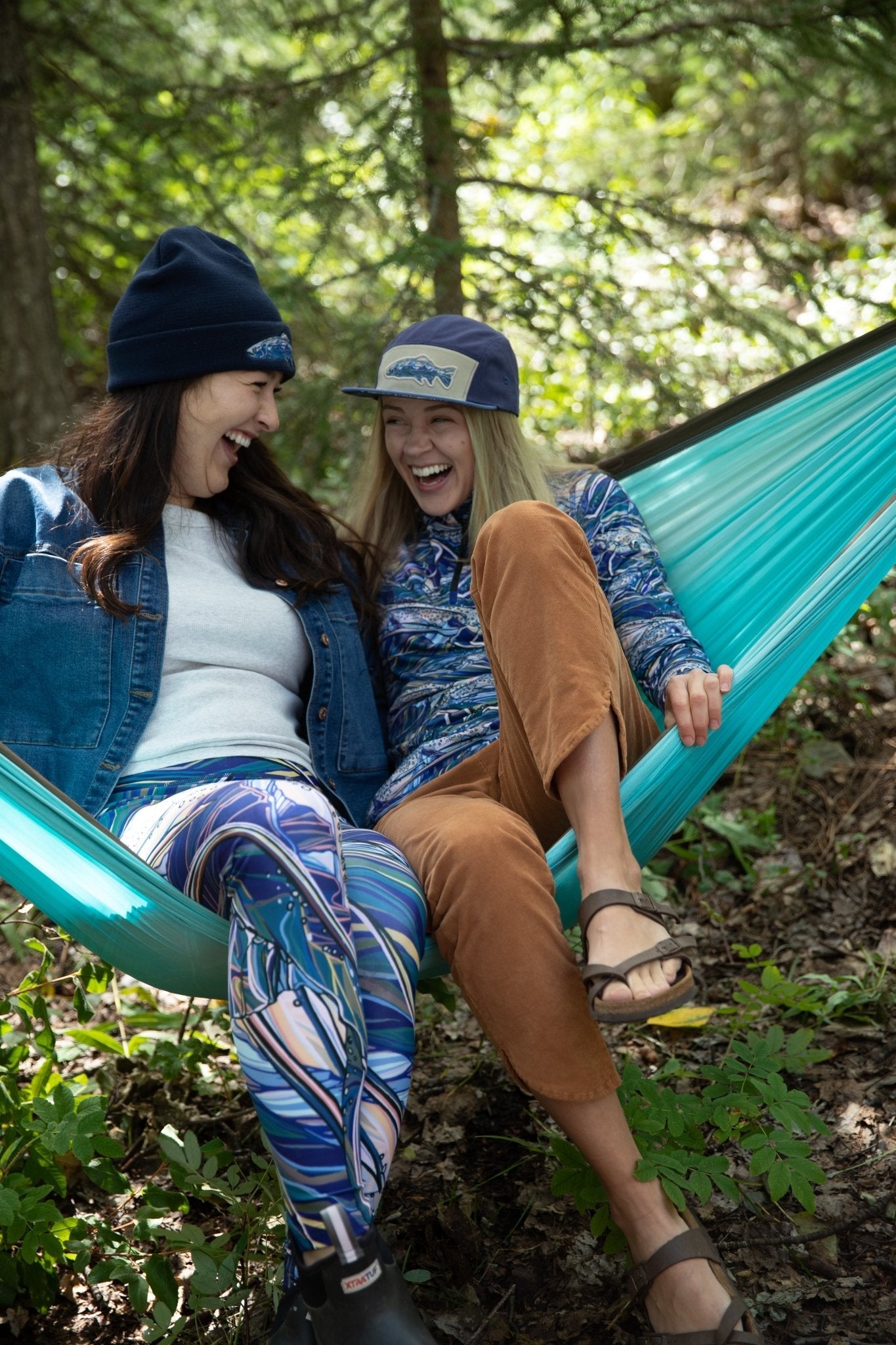 FisheWear Rainbow Ridge Thermal 1/4 Zip Top in vibrant rainbow colors, made from cozy thermal fabric perfect for outdoor wear.