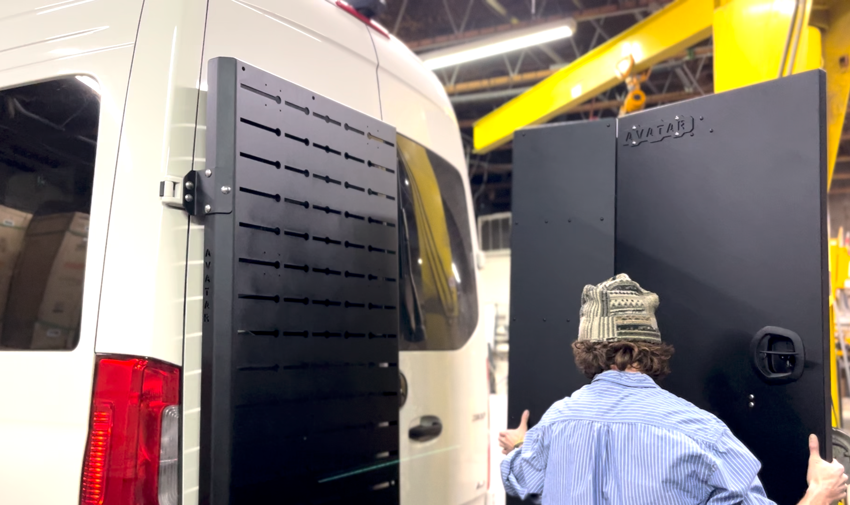 Avatar Offroad Sir Packs-a-lot storage mount attached to the rear door of a Sprinter van for organized cargo management.