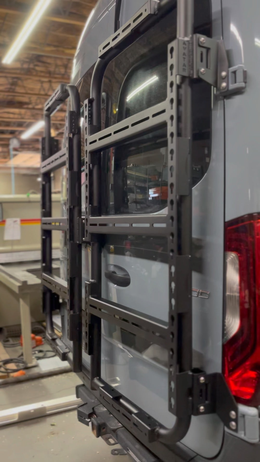 Avatar Offroad Avatar Massif van rear door storage mount system attached to vehicle rear door for organized gear storage