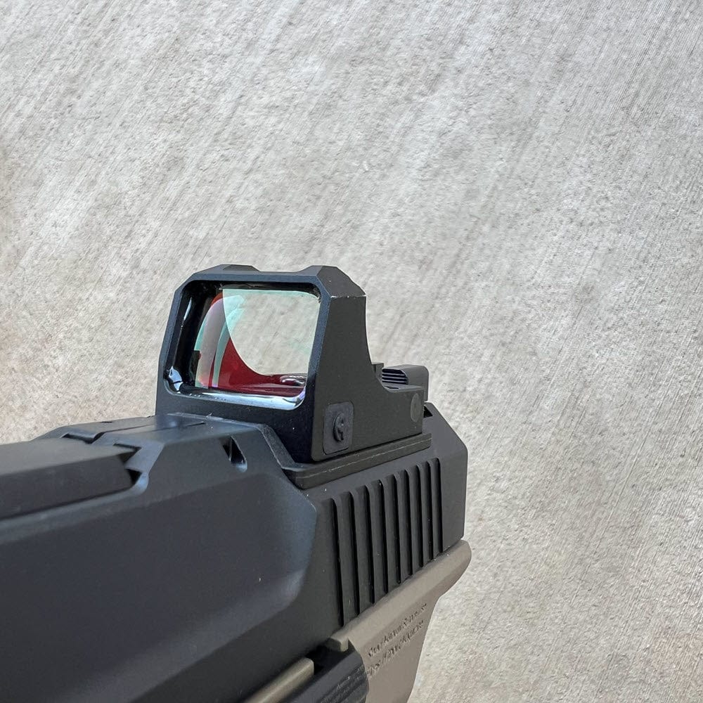 Red Dots Regulator Mini tactical sight by SFT2 Tactical featuring a compact design with adjustable red dot reticle.