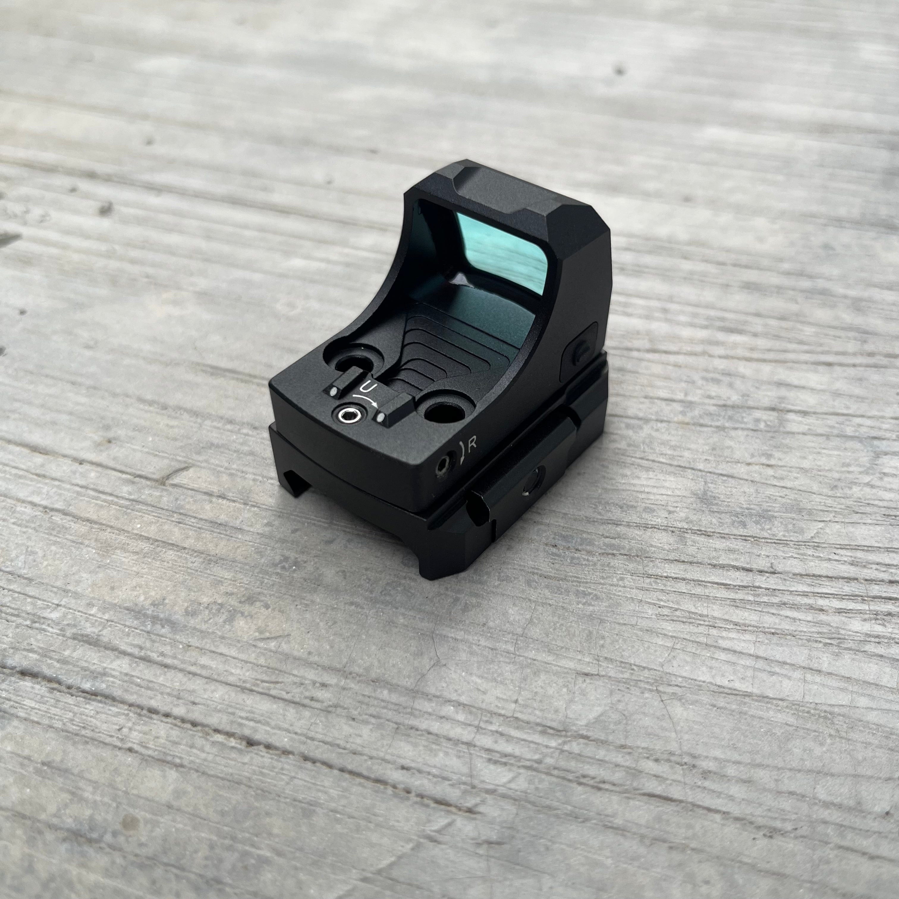 SFT2 Tactical Regulator Mini red dot sight mounted on firearm for quick target acquisition and accurate aiming.