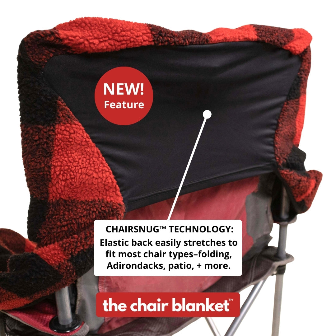 Red plaid City Bonfires Chair Blanket draped over a chair, showing its stretchy back design and cozy, soft fabric.