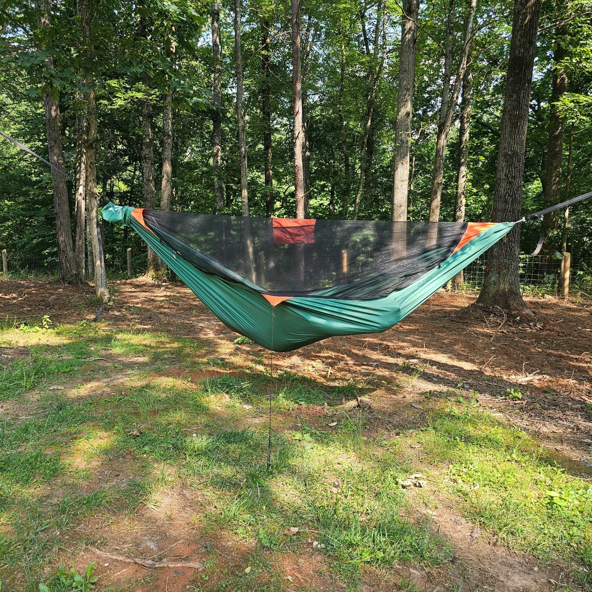 Hanging High Hammocks REM hammock with bug net, cinch buckles, ridgeline organizer, underquilt clips, and hanging straps.