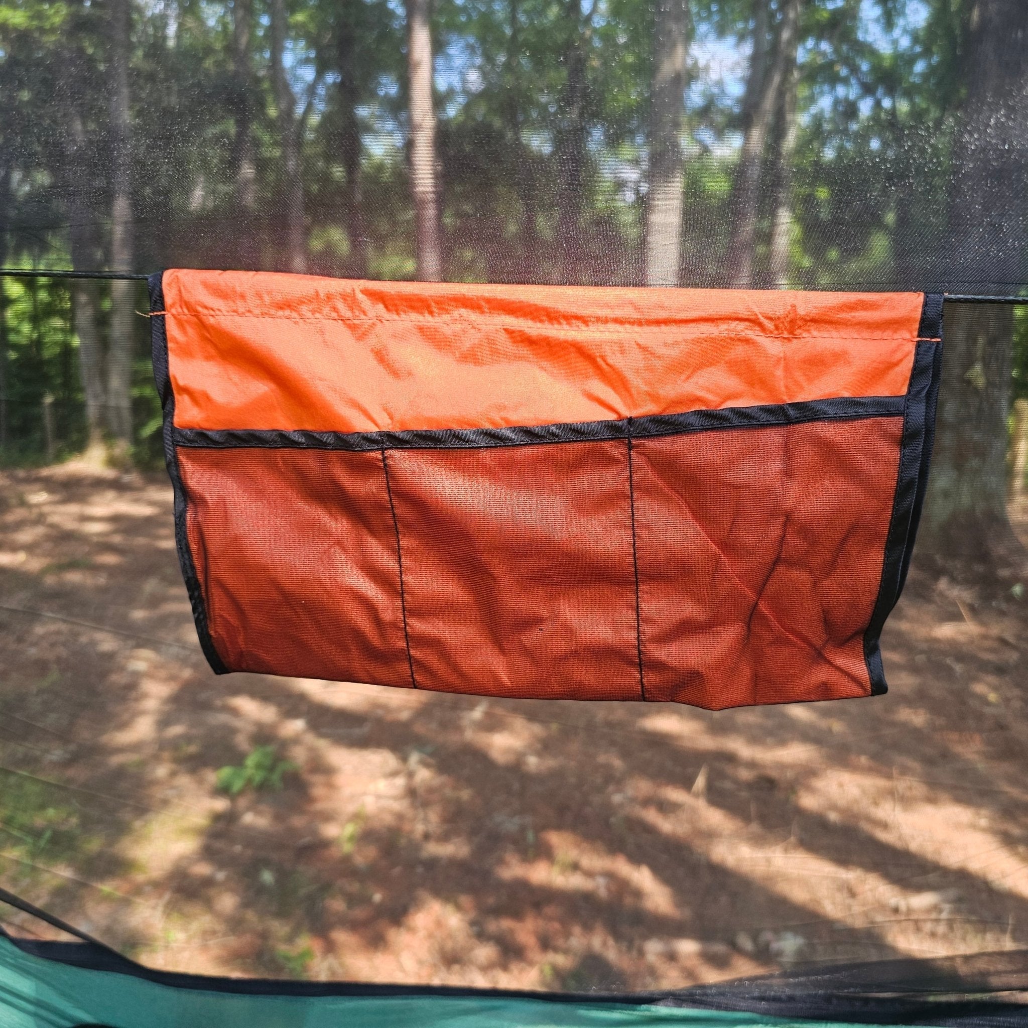 Hanging High Hammocks REM Hammock with bug net, cinch buckles, ridgeline organizer, underquilt clips, and hanging straps.