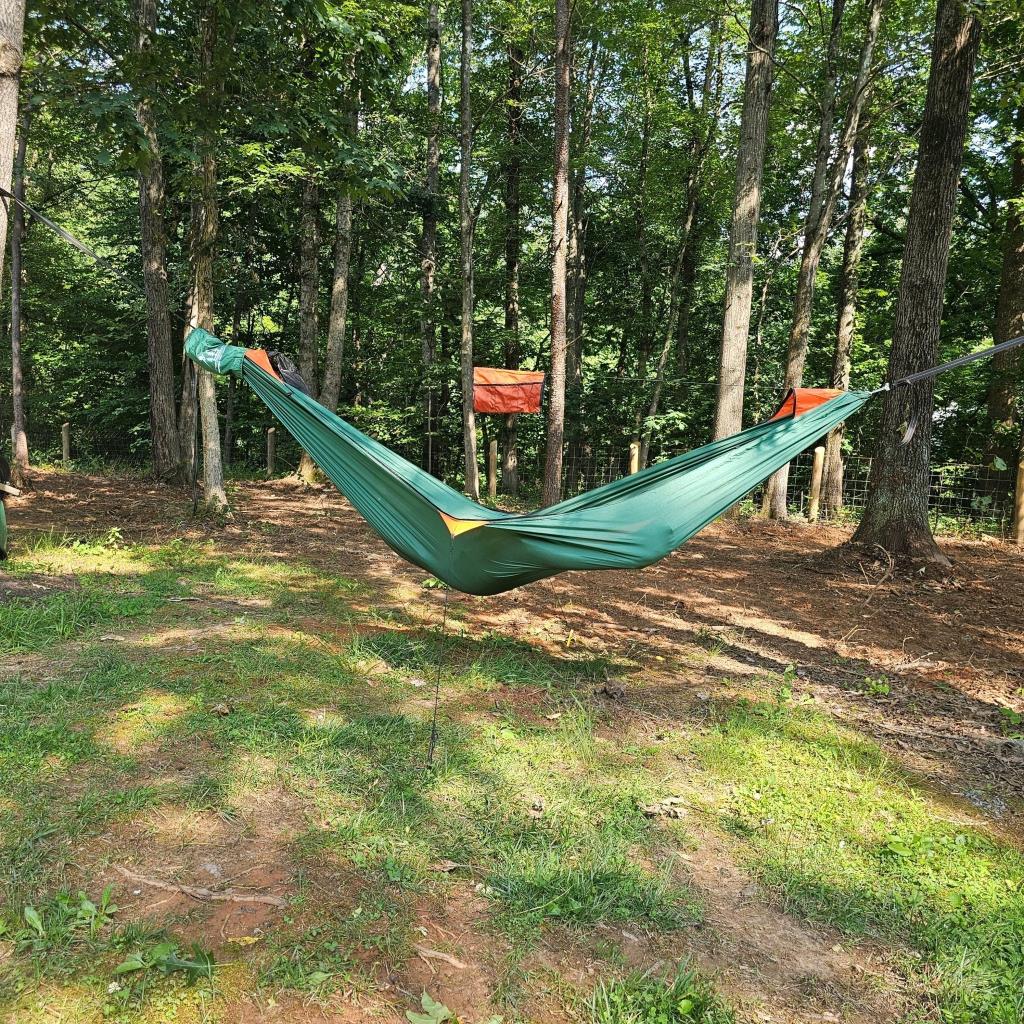 Hanging High Hammocks REM Hammock complete sleep system with bug net, cinch buckles, ridgeline organizer, underquilt clips, and straps.
