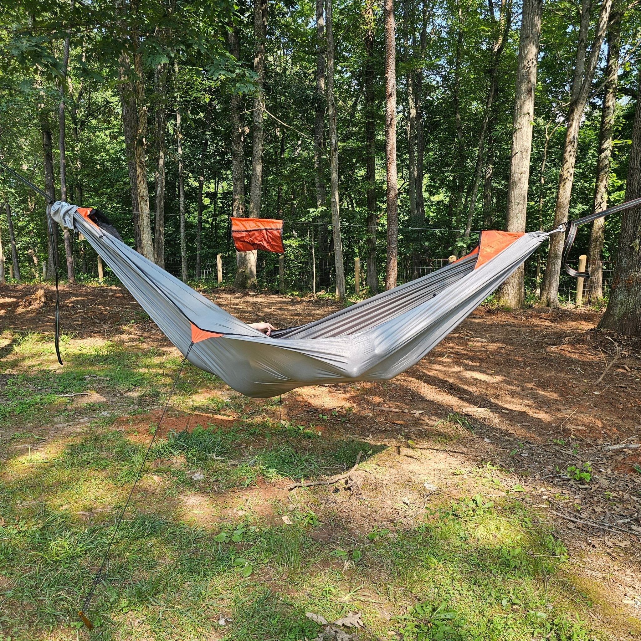Hanging High Hammocks REM Hammock complete sleep system with bug net, cinch buckles, underquilt, straps, and accessories for camping.