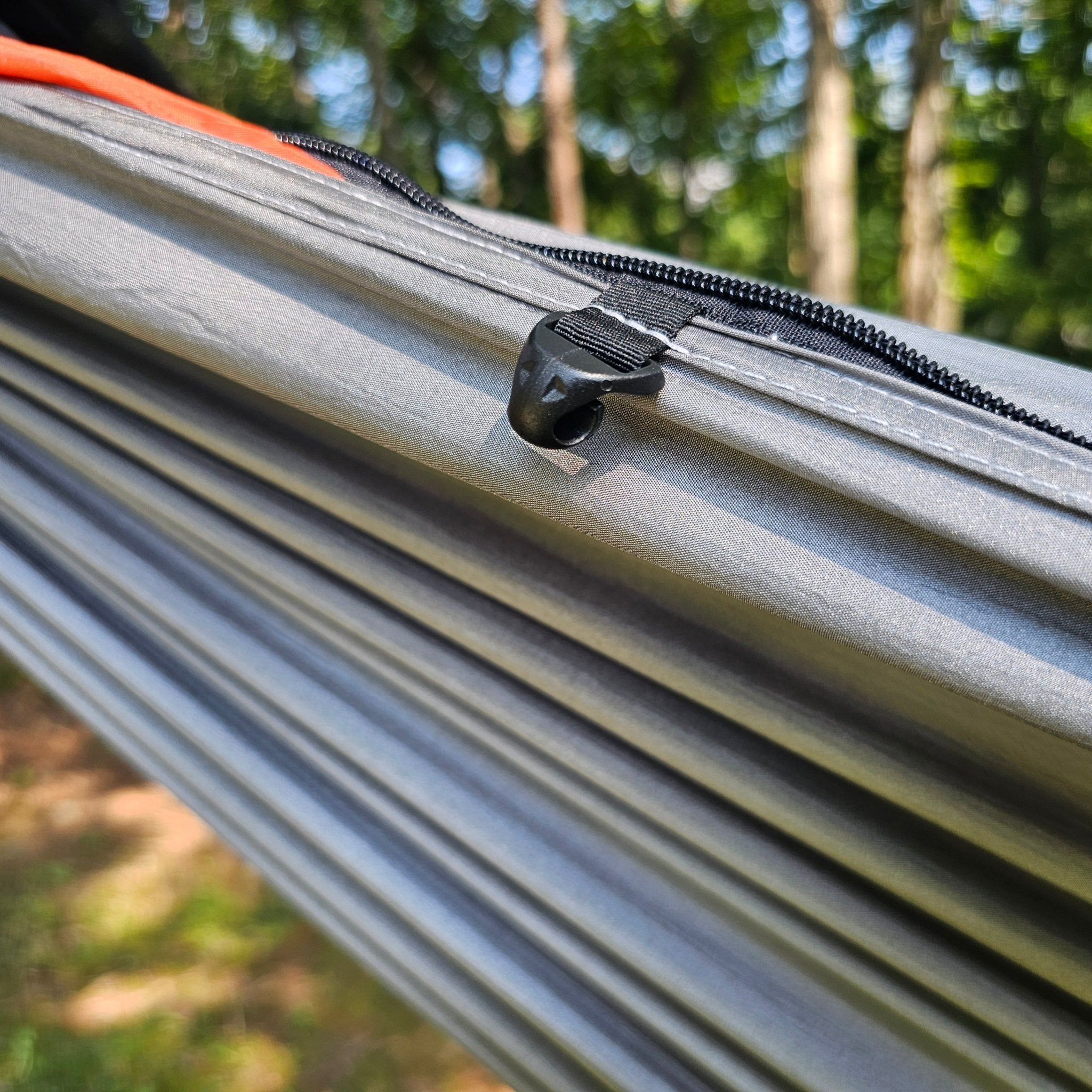 REM Hammock complete sleep system with bug net, cinch buckles, ridgeline organizer, underquilt clips, and Hanging High Hammocks straps.