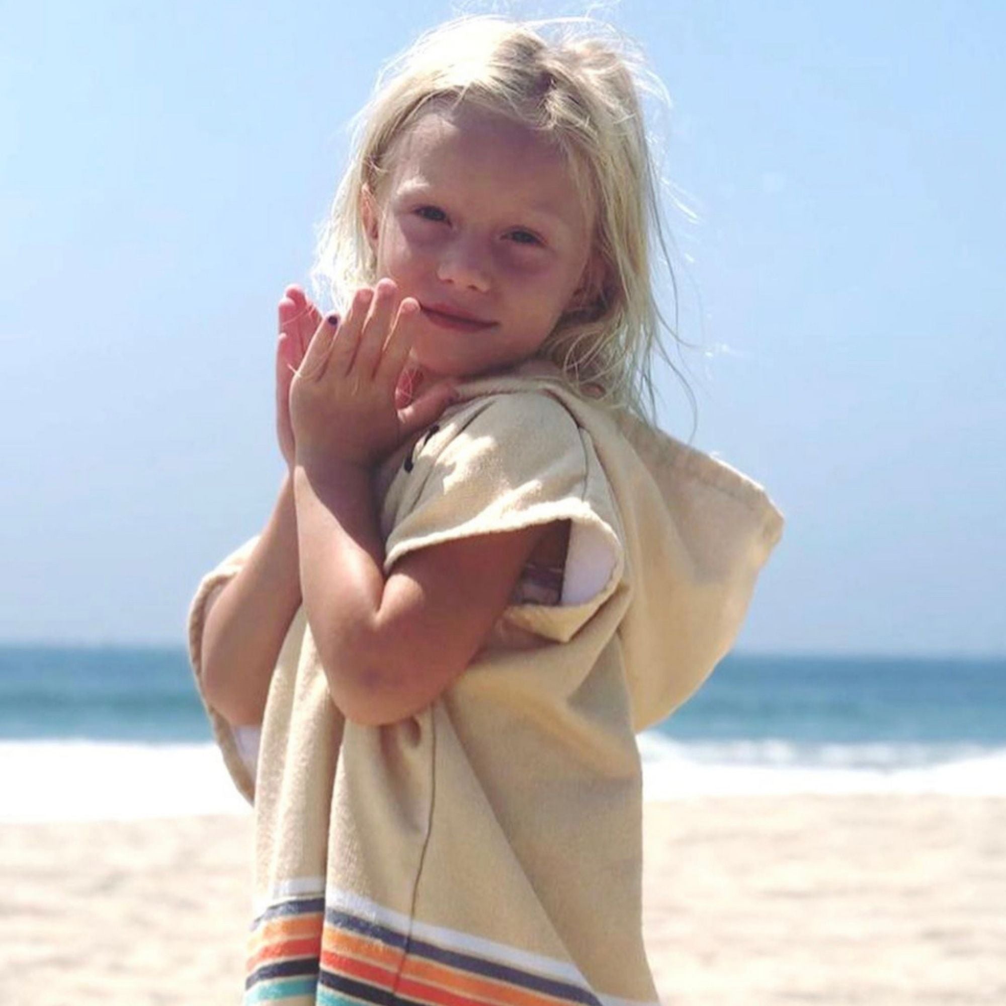 Kids' Retro Sand Changing Towel Poncho by COR Surf, small size, featuring colorful retro design, made for quick drying and comfort.