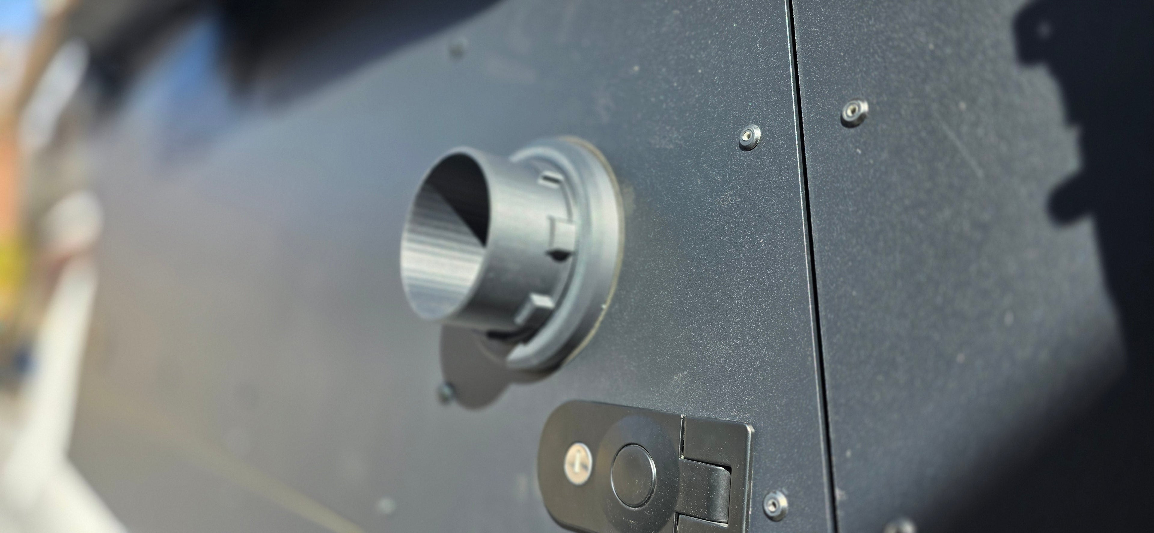 Muddy River Outdoors Diesel Heater Port for campers, showcasing a durable pass-through design for efficient heating.