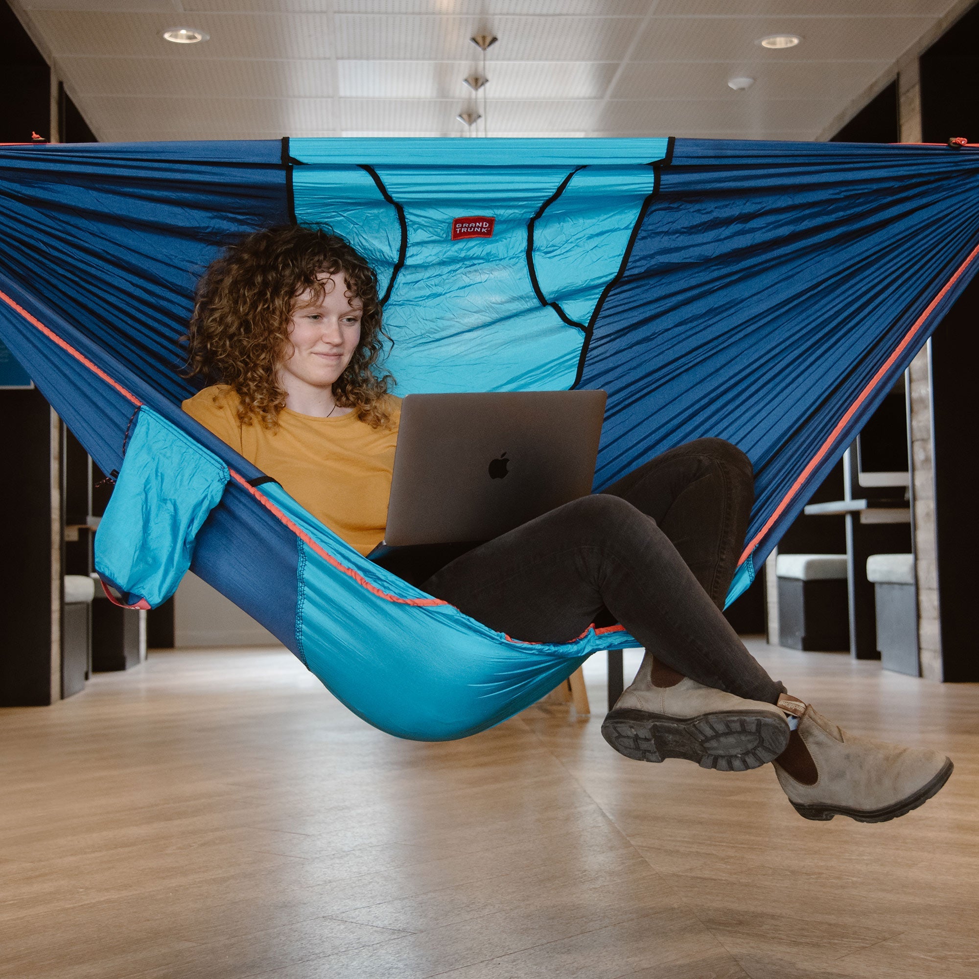 GrandTrunk ROVR™ Hanging Chair in a stylish design, showcasing its cozy fabric and sturdy hanging mechanism.