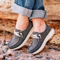 Ariat women's washed black Hilo western shoes with tan accents and stitching, casual slip-on style.