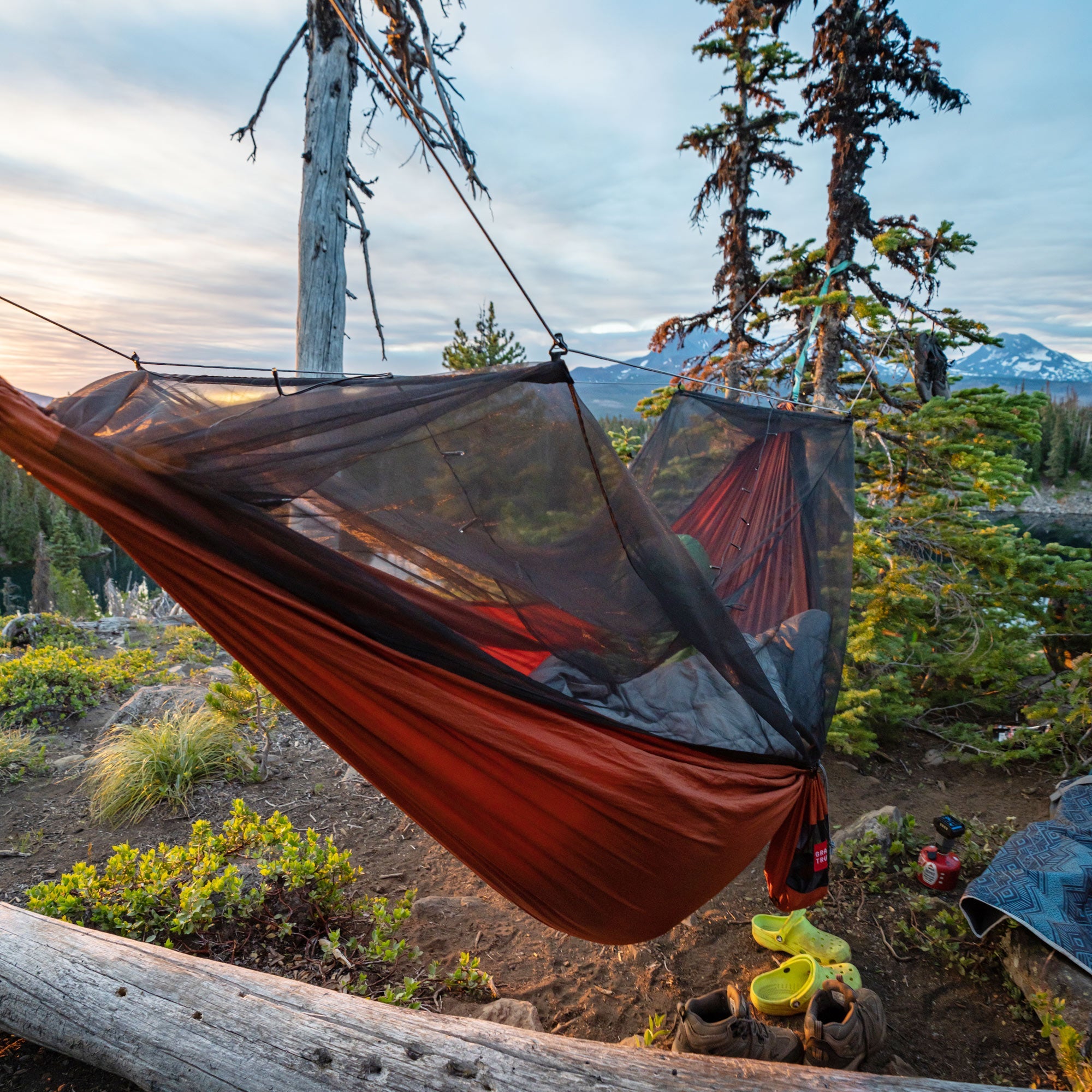 GrandTrunk Skeeter Beeter XT Mosquito Net Hammock set up outdoors, showcasing its protective netting and comfortable design.