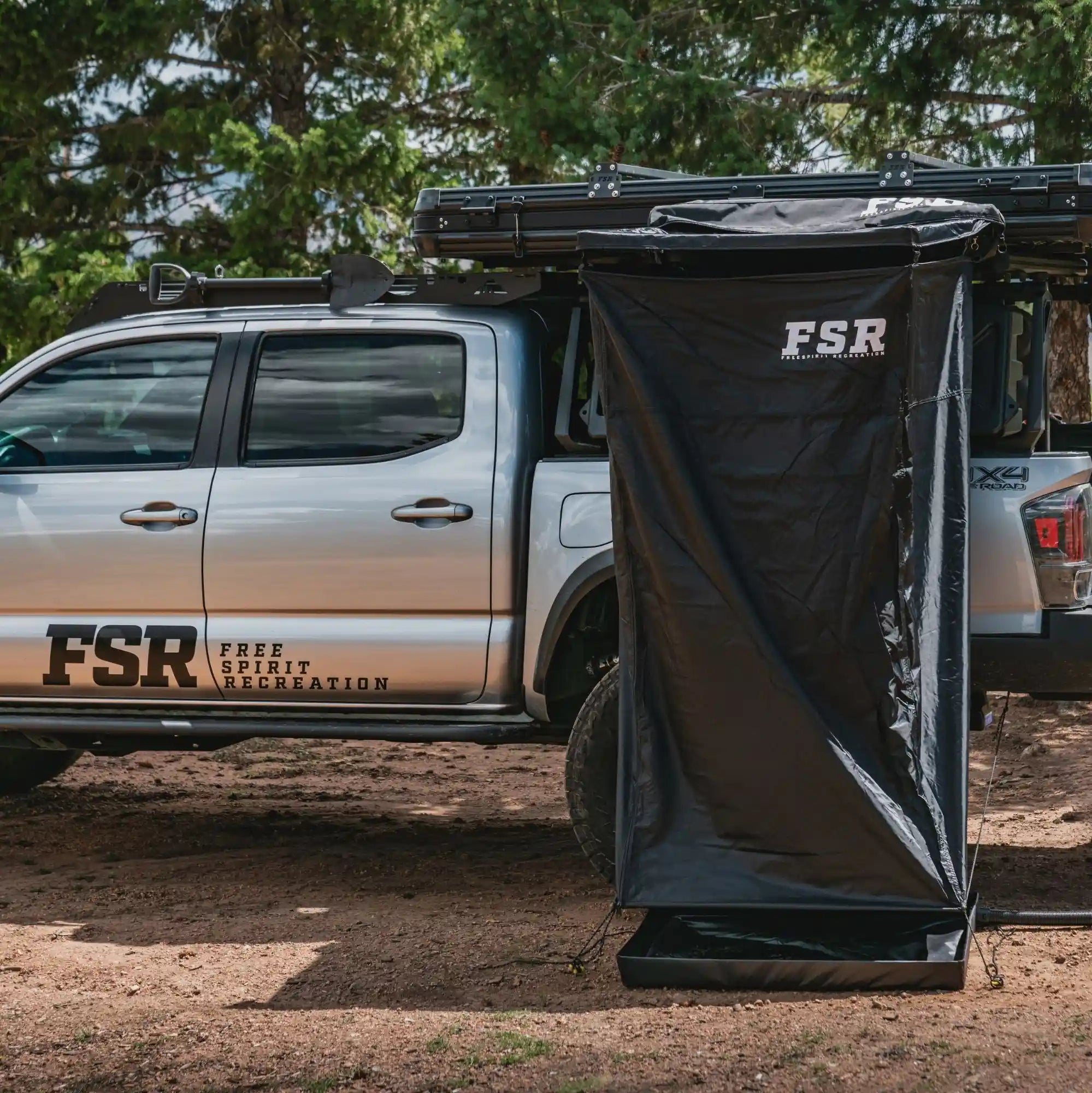 Freespirit Recreation shower awning set up, showcasing its spacious canopy and sturdy support for outdoor use.