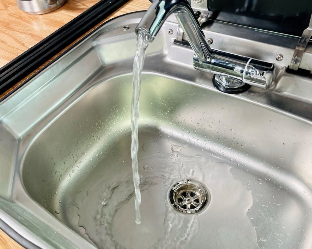 TNTvans Mercedes Sprinter 170 campervan conversion DIY kit with sink and faucet for camper van water setup.