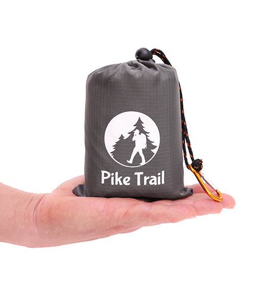 Pike Trail pocket blanket folded with compact size, ideal for outdoor picnics and hiking trips, made from durable, water-resistant material.