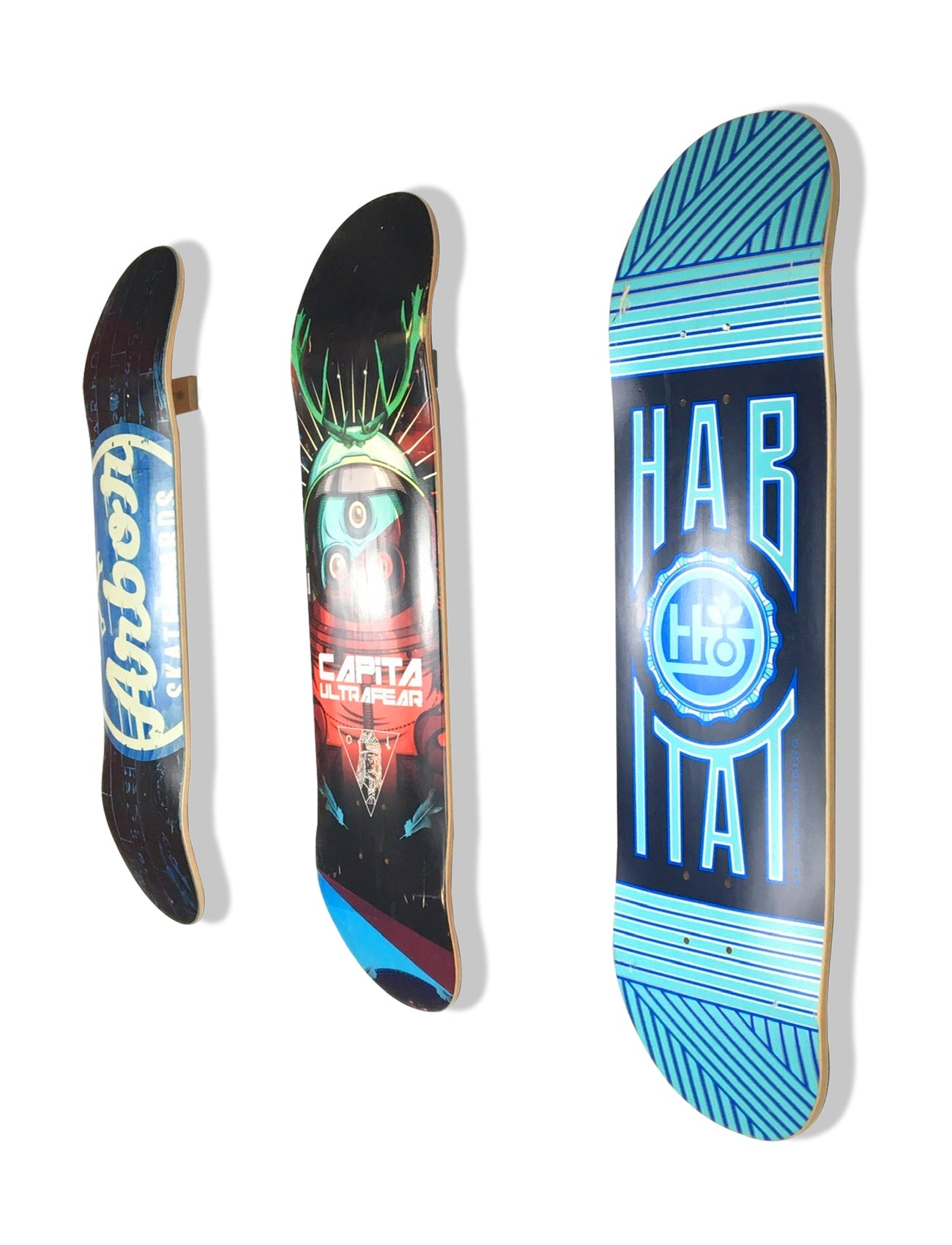 Rado Racks The Floater deck display holding multiple colorful skateboards on a wall.