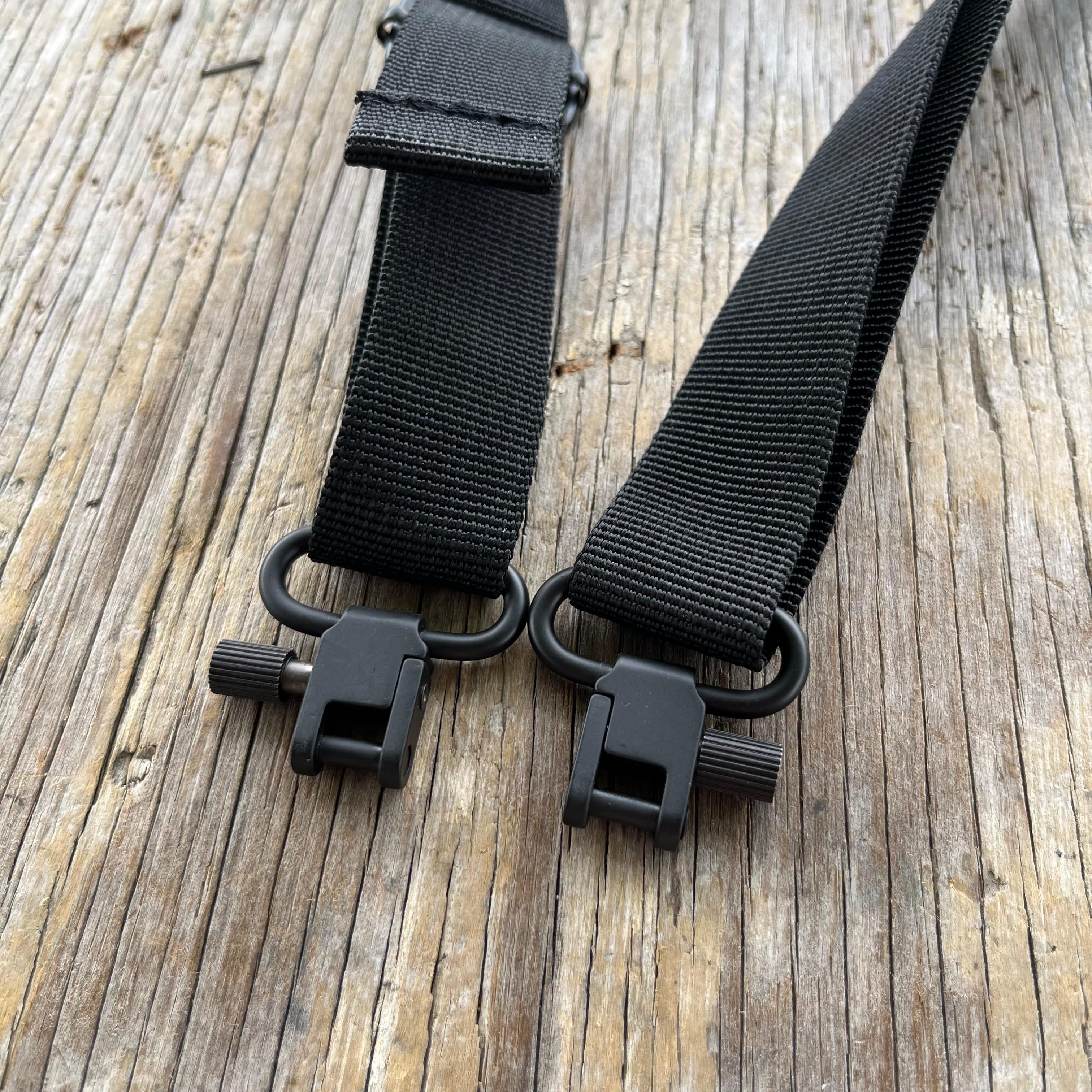 SFT2 Tactical hunting sling attached to a rifle, adjustable strap for secure carrying and quick access during outdoor hunts.