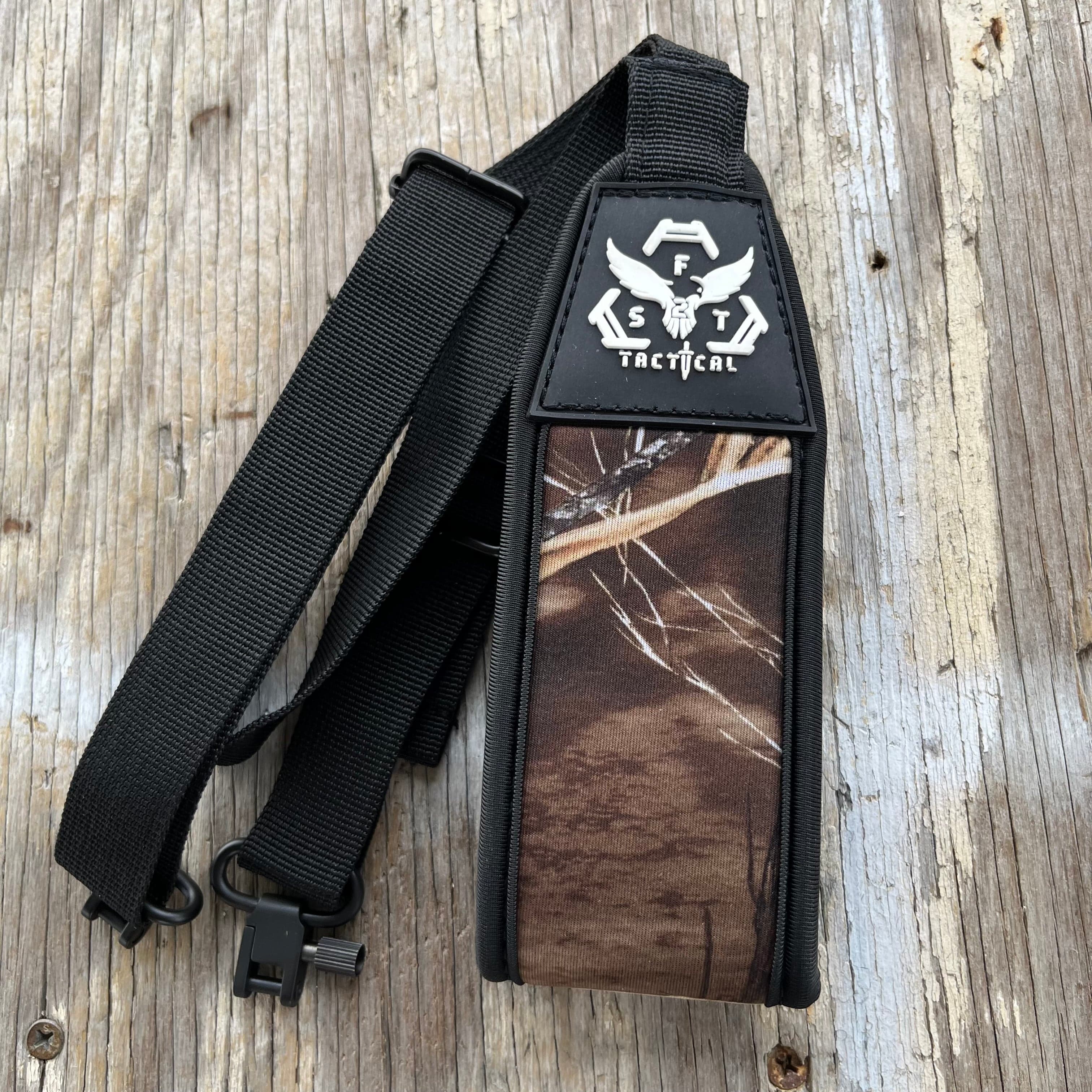 SFT2 Tactical hunting sling attached to a rifle, adjustable strap for secure firearm carrying during outdoor hunting activities.