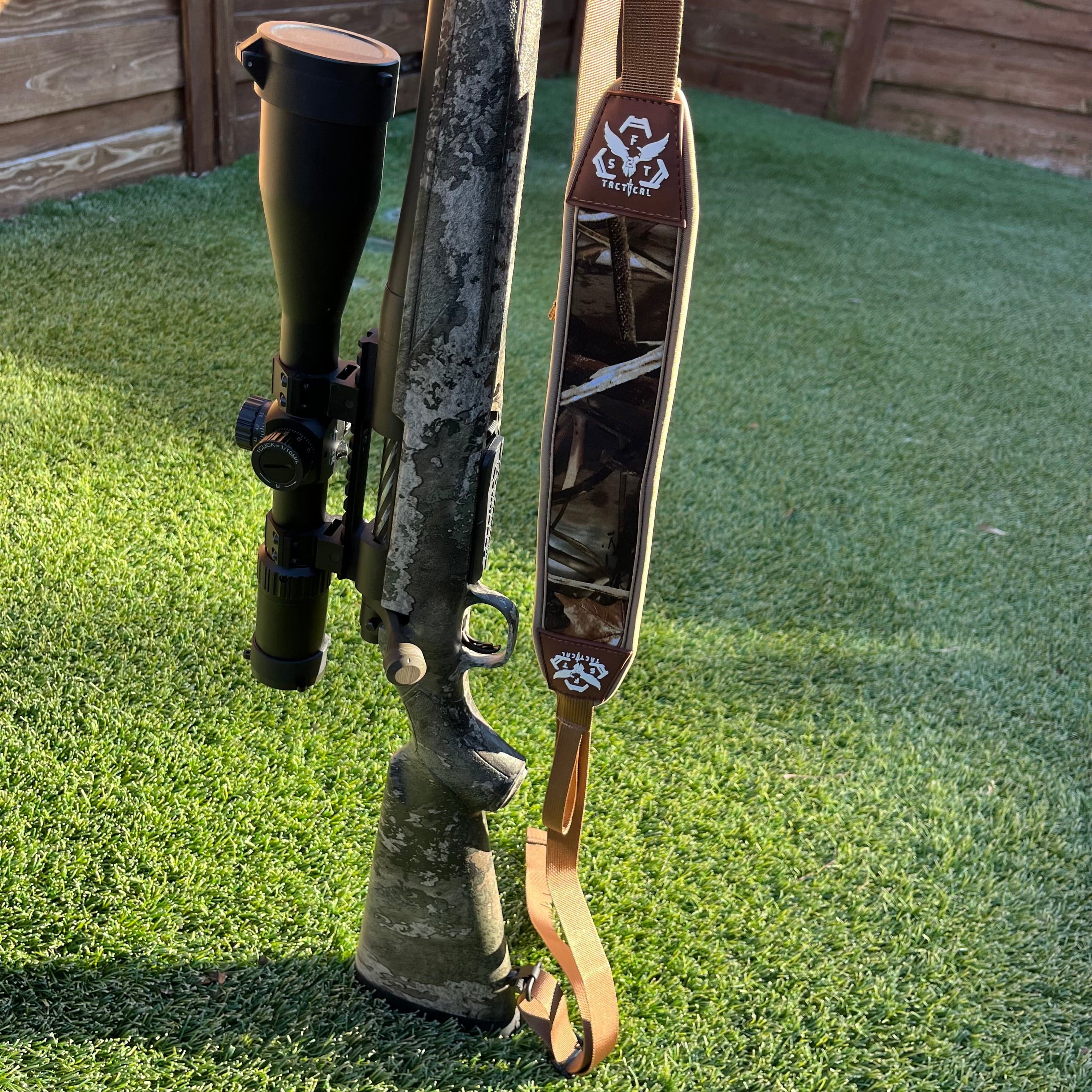 Black SFT2 Tactical hunting sling with adjustable straps and quick-release buckle, designed for secure firearm carrying.
