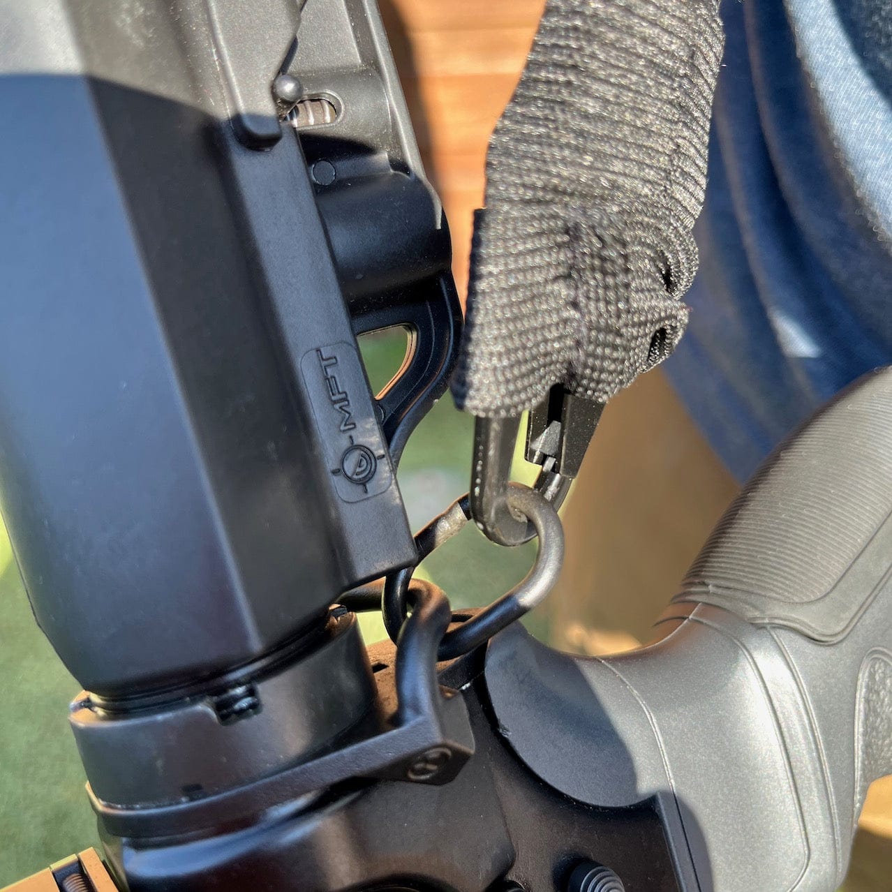 SFT2 Tactical single point bungee sling, featuring adjustable straps and durable materials for tactical use.
