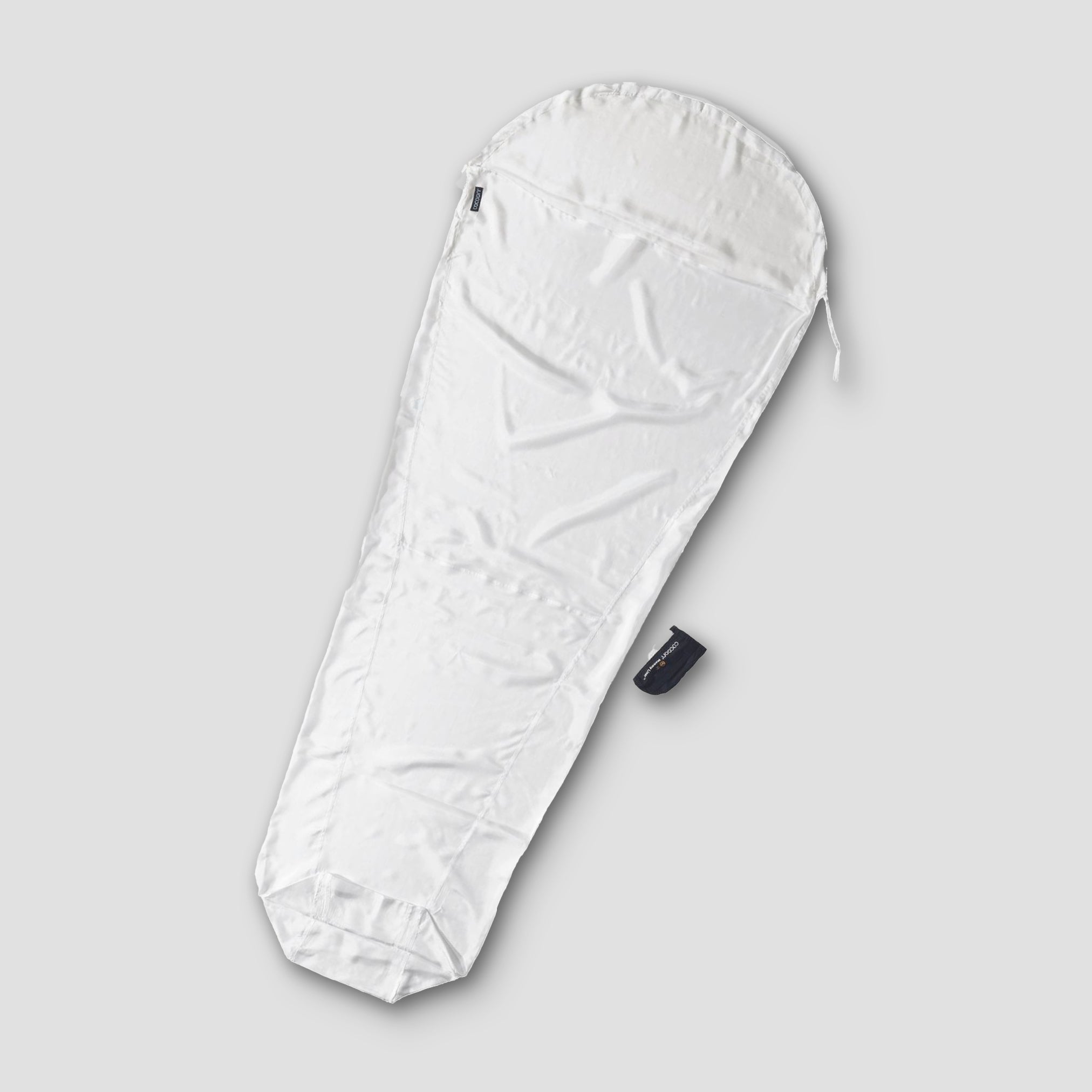 COCOON MummyLiner™ Silk Small, a luxurious silk sleeping liner with a smooth, lightweight fabric ideal for travel and camping.