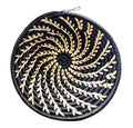 Small black woven Raffia African basket by Reflektion Design, showcasing intricate handwoven texture and compact size.