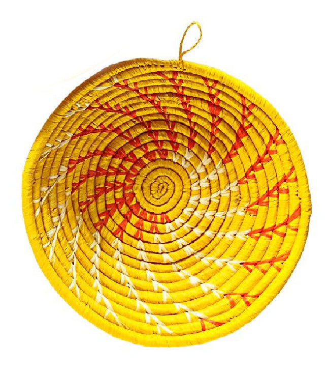 Small woven Raffia African baskets in yellow, styled with a colorful background, by Reflektion Design.